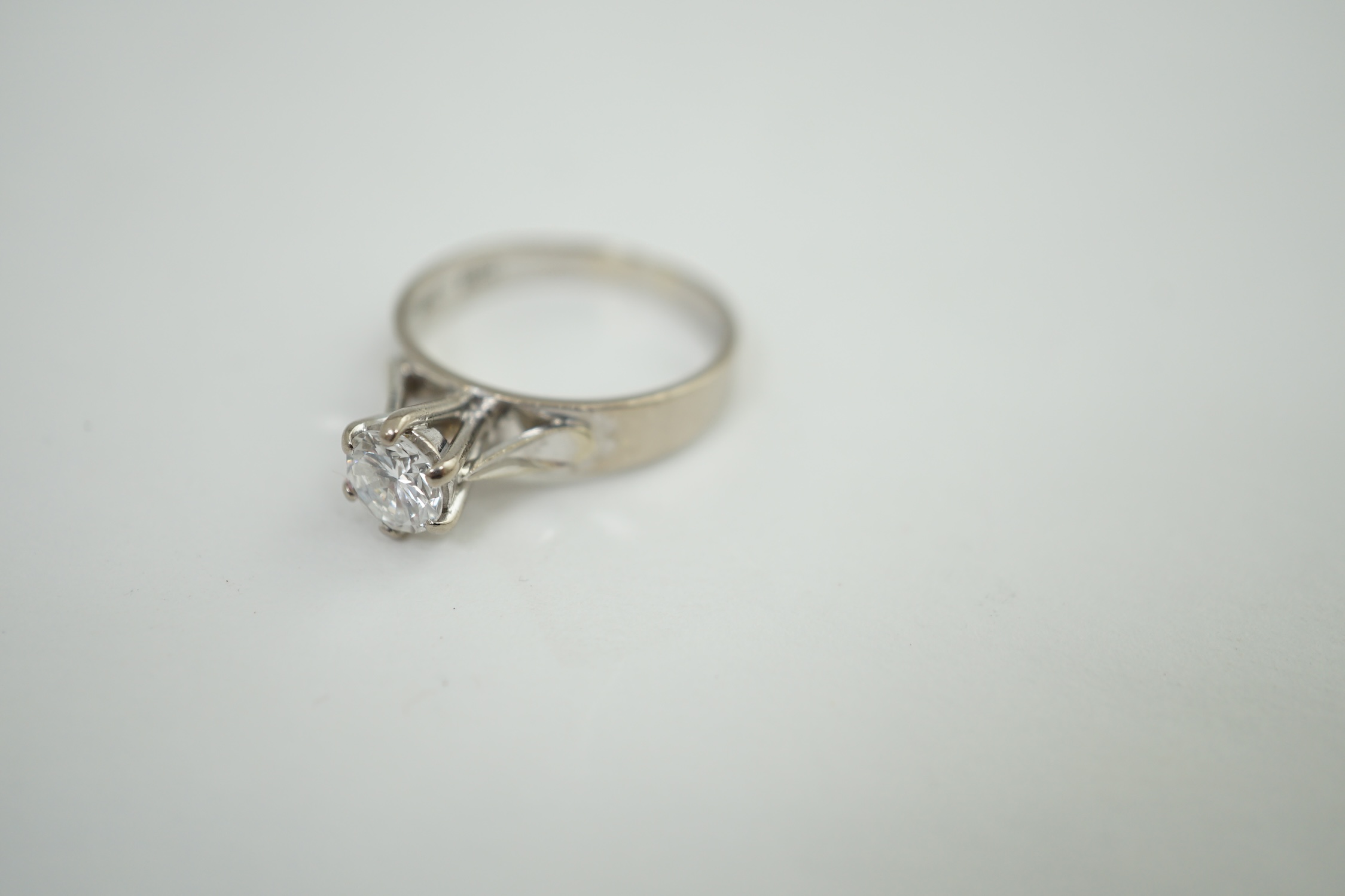 A late 20th century 18ct white gold and solitaire diamond set ring